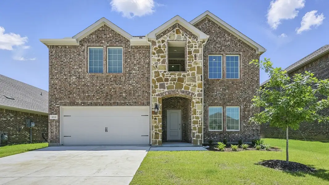 Representative exterior photo of a completed home built from the Medbourne by D.R. Horton in Silverado, Aubrey, TX (Image 1). Representative exterior photo of a completed home built from the Medbourne by D.R. Horton in Silverado, Aubrey, TX (Image 1).