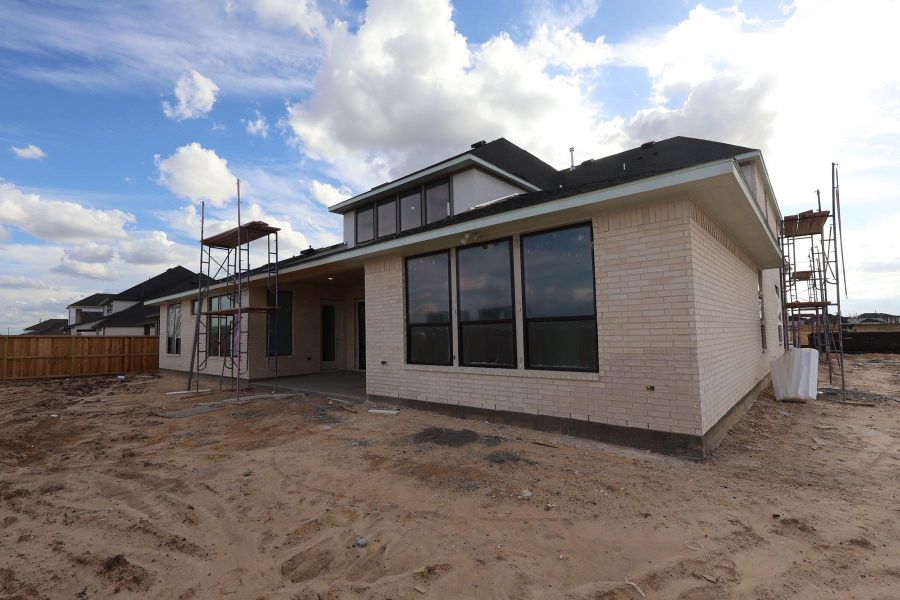 Exterior details and patio area of a home in Dunham Pointe, Cypress (Image 1). Exterior details and patio area of a home in Dunham Pointe, Cypress (Image 1).
