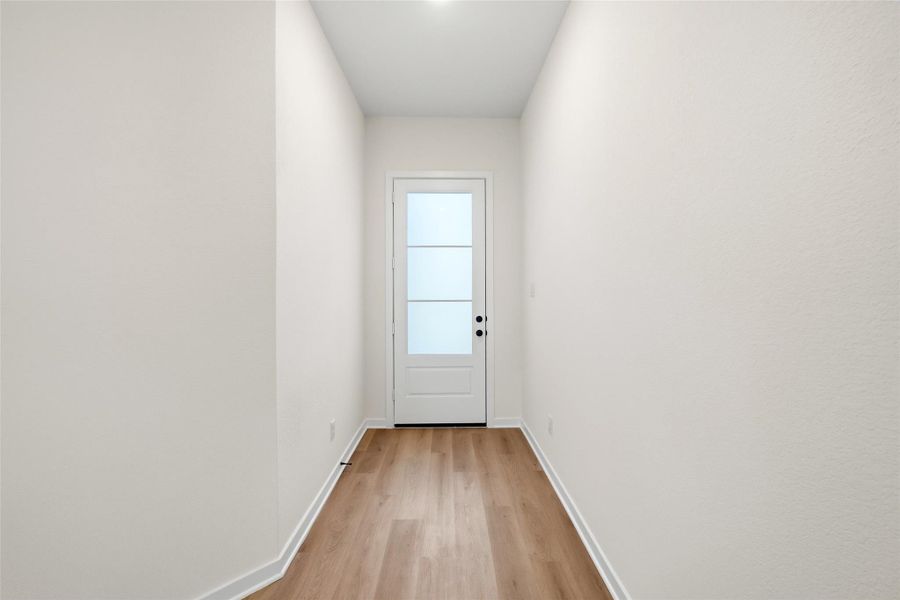 A look back to the entry way. Notice the high-end entry door and large entry way. Ample space for storage or decor.