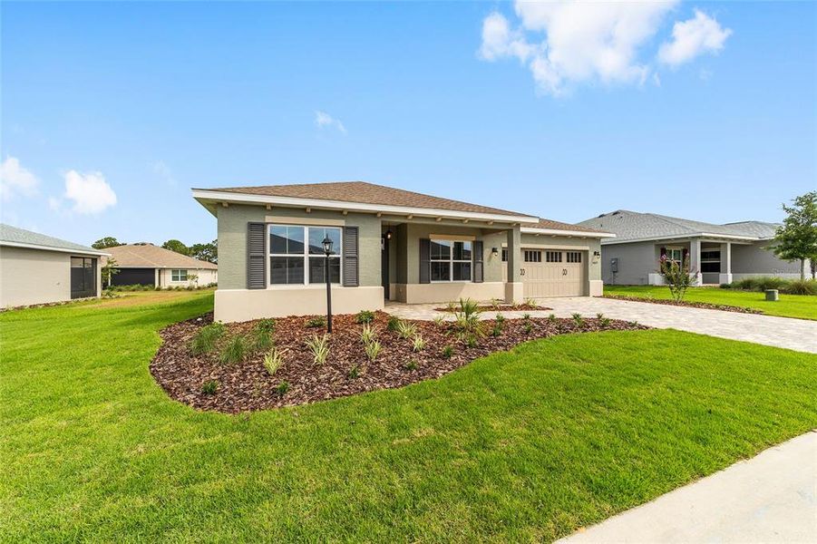 Front exterior of a new home in On Top of the World Communities, Ocala, FL, highlighting curb appeal (Image 11).