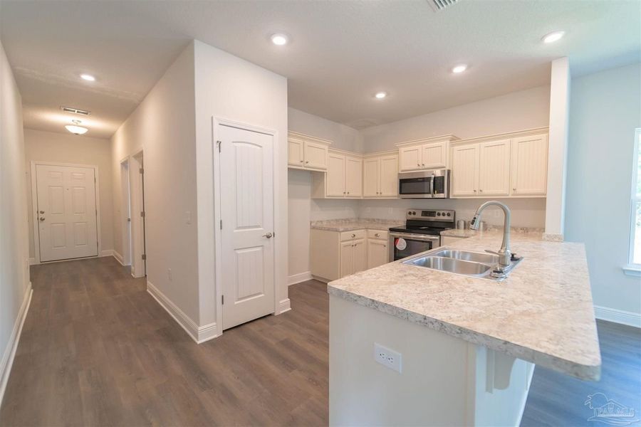 Representative furnished interior of a home built from the 1766 by Adams Homes in East Bay, Panama City (Image 6). Representative furnished interior of a home built from the 1766 by Adams Homes in East Bay, Panama City (Image 6).