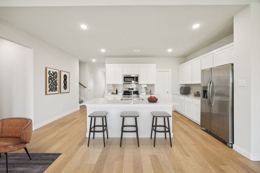 Kitchen in the Masters home plan by Trophy Signature Homes – REPRESENTATIVE PHOTO