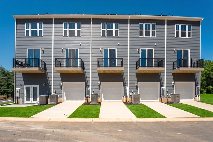 Front exterior of a new home in Ashmore Square, Charlotte, NC, highlighting curb appeal (Image 2). Front exterior of a new home in Ashmore Square, Charlotte, NC, highlighting curb appeal (Image 2).