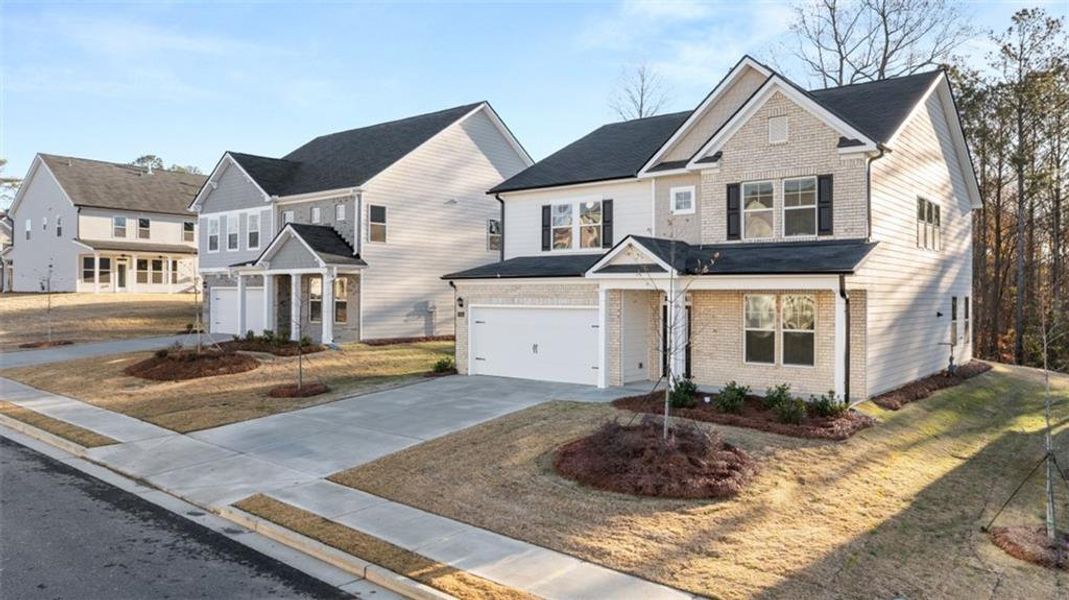 Front exterior of a new home in Water Oak Estates, Lawrenceville, GA, highlighting curb appeal (Image 23).