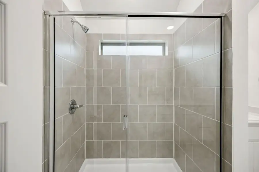 Primary Bathroom in the Spruce home plan by Trophy Signature Homes - REPRESENTATIVE PHOTO