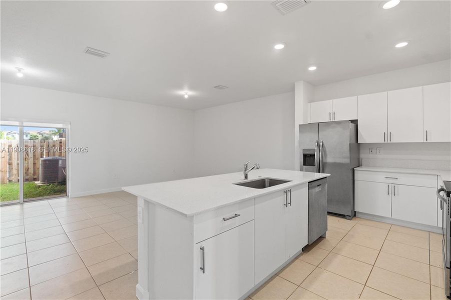 Furnished interior view inside a new home in Harmony Parc, Homestead (Image 12).