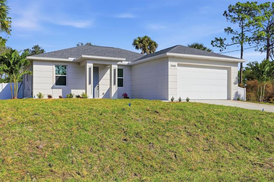 Front exterior of a new home in , North Port, FL, highlighting curb appeal (Image 1). Front exterior of a new home in , North Port, FL, highlighting curb appeal (Image 1).