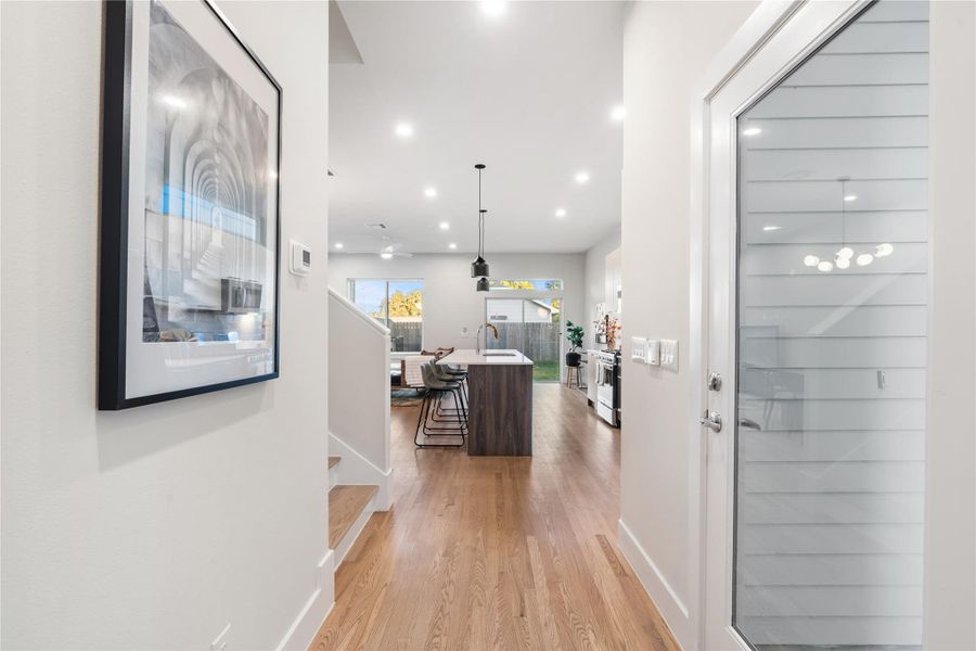 As you enter, you’re greeted by the warm, natural tones of real hardwood floors that lead into an open, inviting floor plan. Enjoy the ease of first-floor living, where everyday moments like bringing in groceries, feel effortless. As you enter, you’re greeted by the warm, natural tones of real hardwood floors that lead into an open, inviting floor plan. Enjoy the ease of first-floor living, where everyday moments like bringing in groceries, feel effortless.