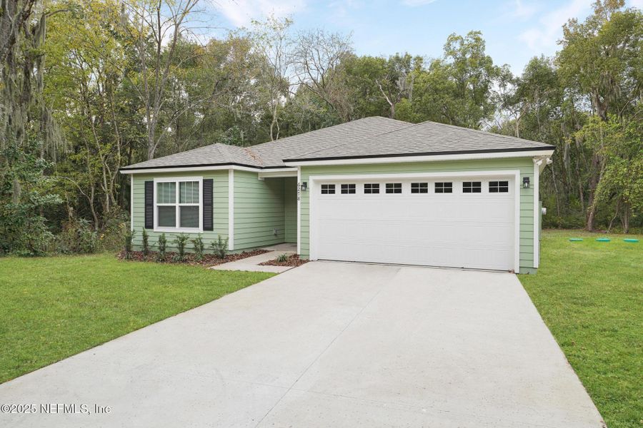 Front exterior of a new home in , Jacksonville, FL, highlighting curb appeal (Image 2).