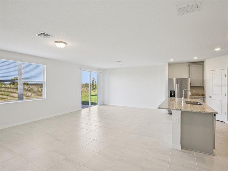 Spacious, unfurnished interior of a new home in The Reserve at Hammock Oaks - Signature Series, Lady Lake (Image 8).