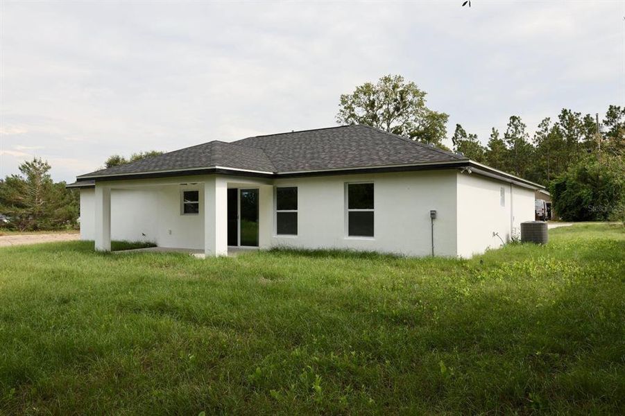 Front exterior of a new home in , Ocklawaha, FL, highlighting curb appeal (Image 15).