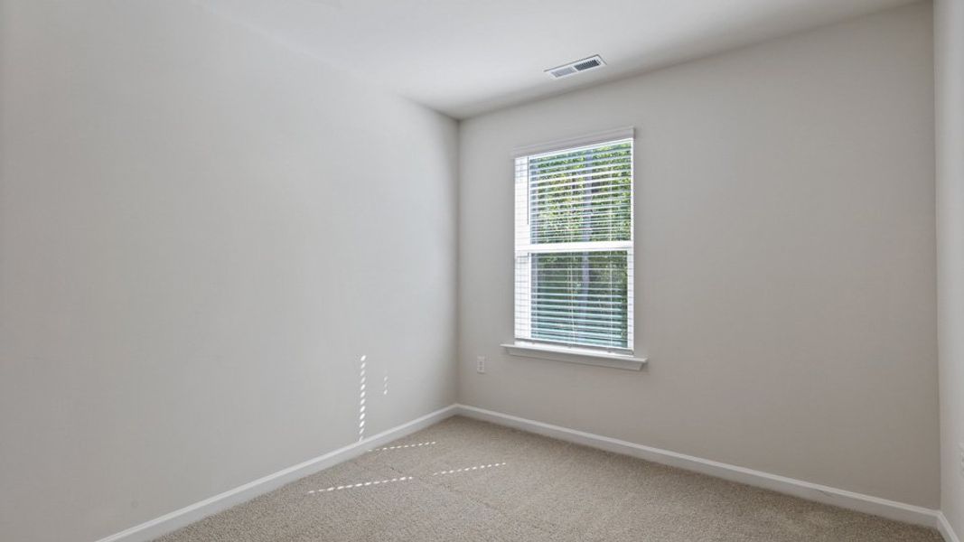 Spacious, unfurnished interior of a new home in Edinborough Townes, Gibsonville (Image 15).
