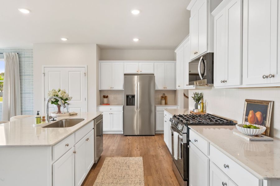 A kitchen with white cabinets. A kitchen with white cabinets.