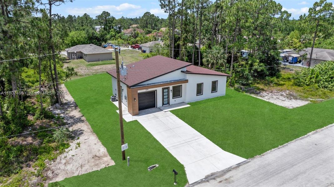 Front exterior of a new home in , Lehigh Acres, FL, highlighting curb appeal (Image 2). Front exterior of a new home in , Lehigh Acres, FL, highlighting curb appeal (Image 2).