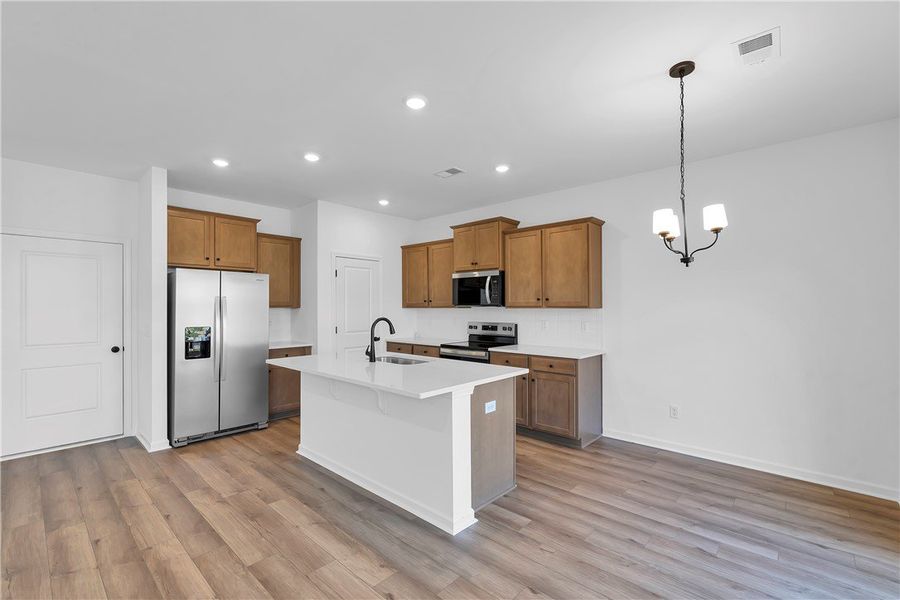 This open concept kitchen features abundant cabine