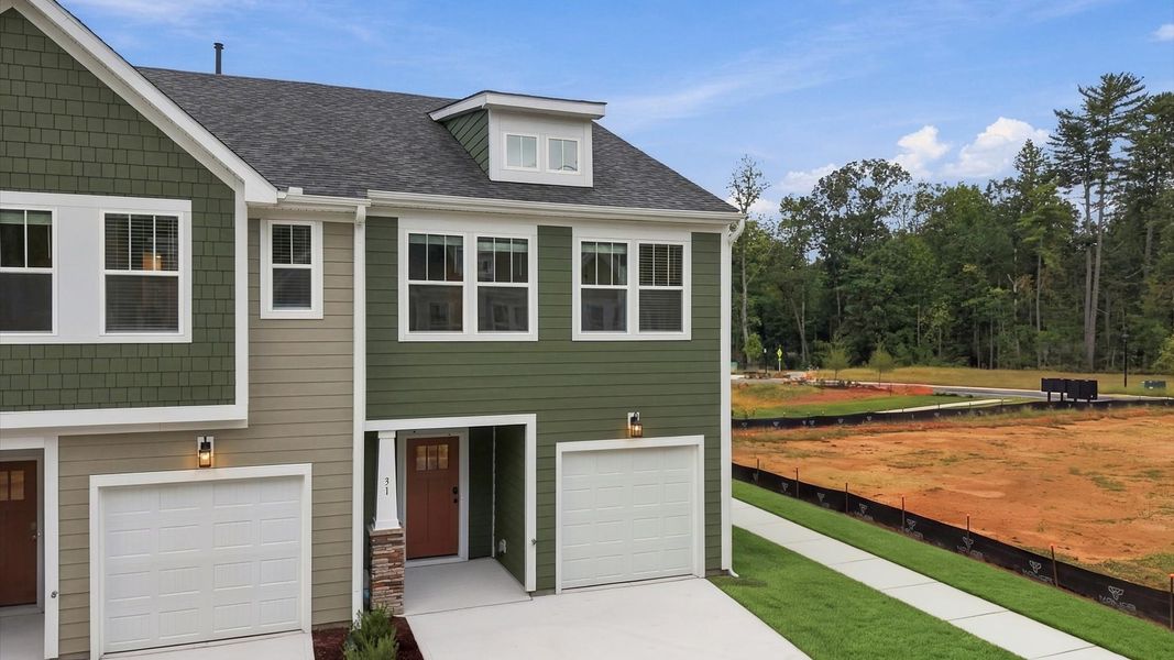 Front exterior of a new home in Brookland Place, Hendersonville, NC, highlighting curb appeal (Image 2). Front exterior of a new home in Brookland Place, Hendersonville, NC, highlighting curb appeal (Image 2).