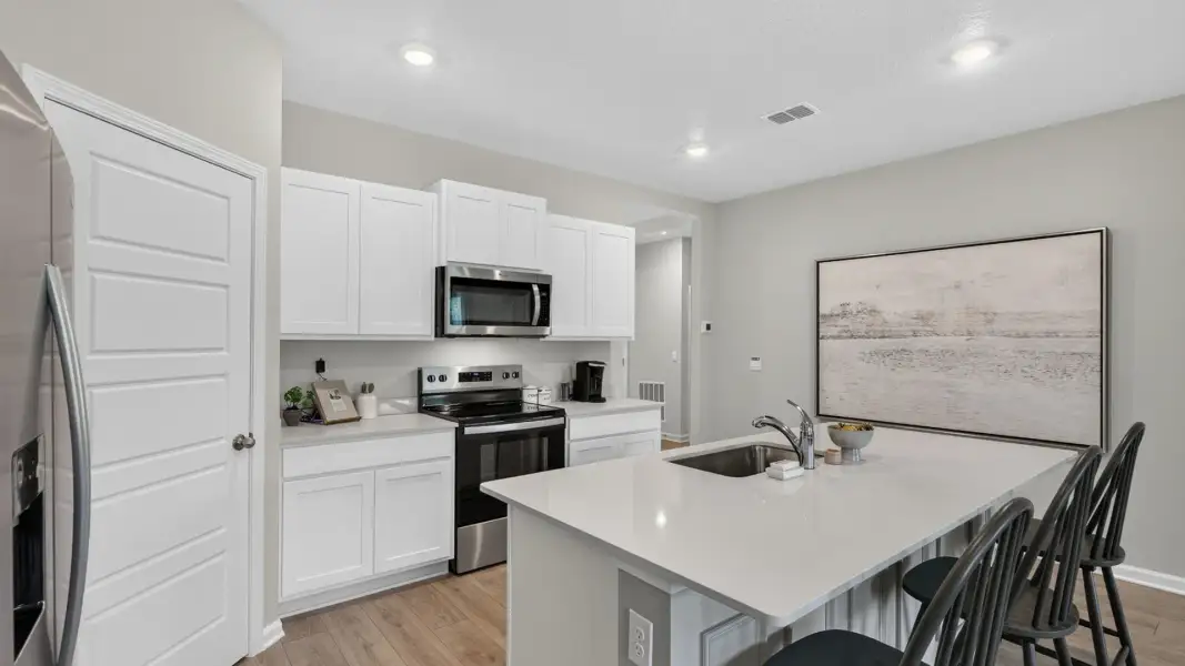Furnished interior view inside a new home in American Village, Palm Coast (Image 7).