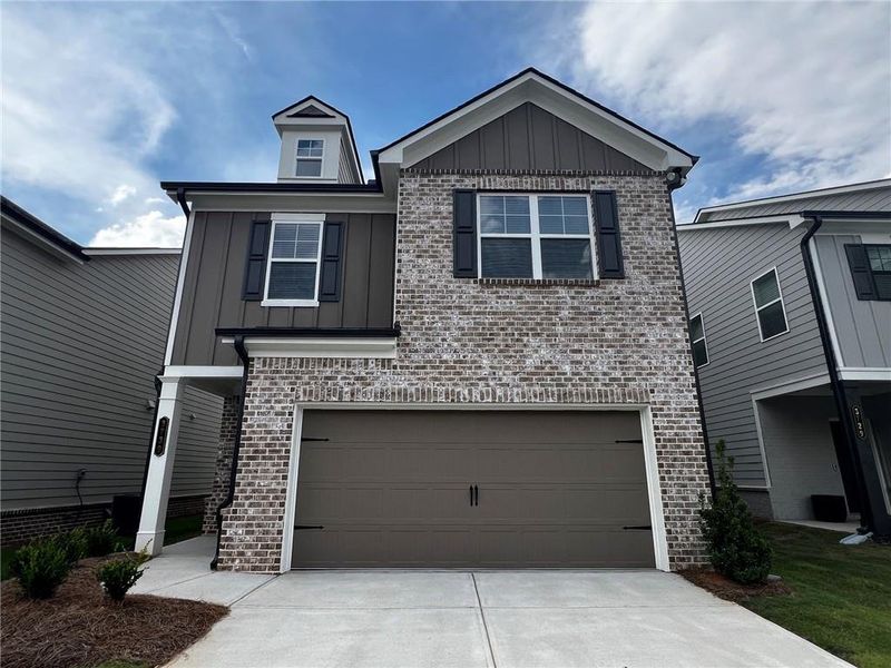 Front exterior of a new home in Crofton Place Enclave, Snellville, GA, highlighting curb appeal (Image 1). Front exterior of a new home in Crofton Place Enclave, Snellville, GA, highlighting curb appeal (Image 1).