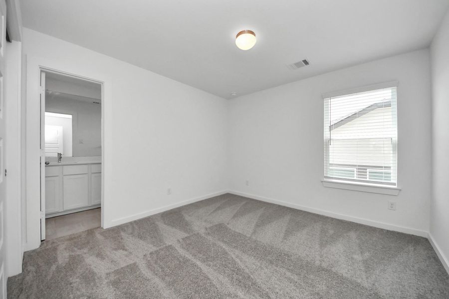 Generously sized secondary bedrooms featuring spacious closets, soft and inviting carpeting underfoot, large windows allowing plenty of natural light, and the added touch of privacy blinds for your personal retreat. Sample photo of completed home with similar floor plan. Actual colors and selections may vary. Generously sized secondary bedrooms featuring spacious closets, soft and inviting carpeting underfoot, large windows allowing plenty of natural light, and the added touch of privacy blinds for your personal retreat. Sample photo of completed home with similar floor plan. Actual colors and selections may vary.