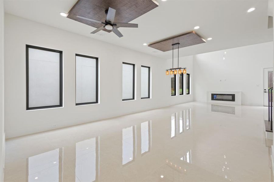 Details with recessed lighting and ceiling fan with notable chandelier
