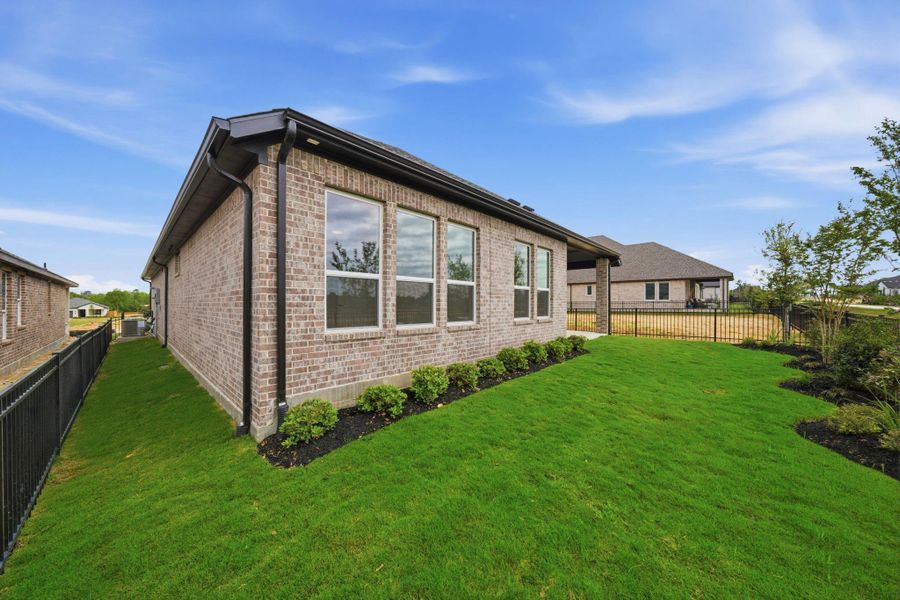 Private backyard with lush green space and room to customize your outdoor oasis.