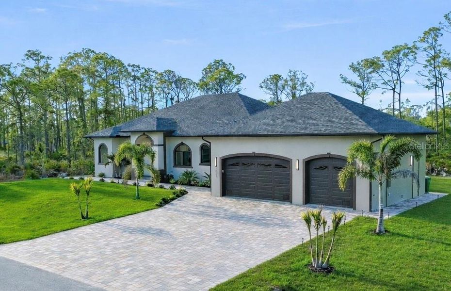 Front exterior of a new home in , Port Charlotte, FL, highlighting curb appeal (Image 27).