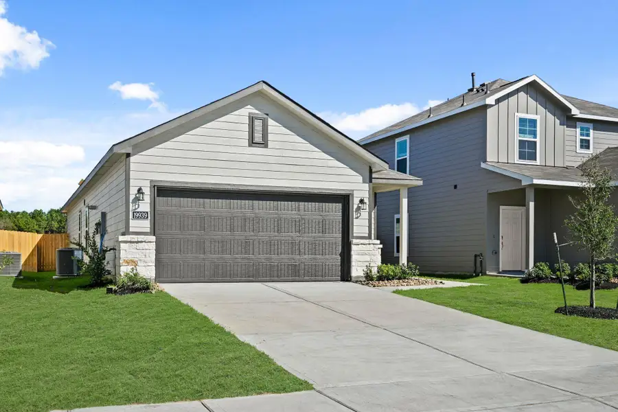 Front exterior of a new home in Northpark South, Porter, TX, highlighting curb appeal (Image 15). Front exterior of a new home in Northpark South, Porter, TX, highlighting curb appeal (Image 15).
