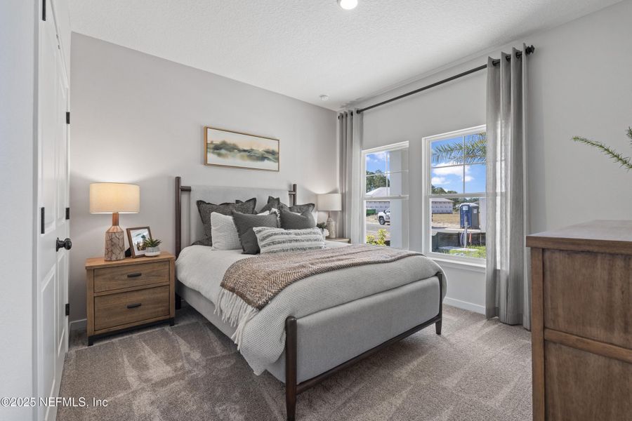 Furnished interior view inside a new home in The Cypress Series at Reserve East, Flagler Beach (Image 17).