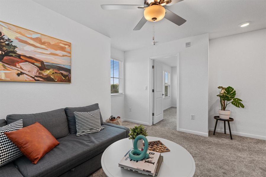 Upstairs loft with natural lighitng and celiing fan