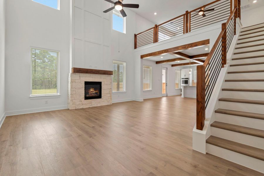 The living room has excetional views of the private backyard and trees.