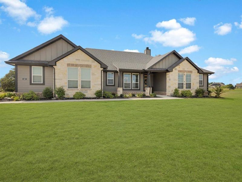 Front exterior of a new home in Regent Park, Springtown, TX, highlighting curb appeal (Image 23).