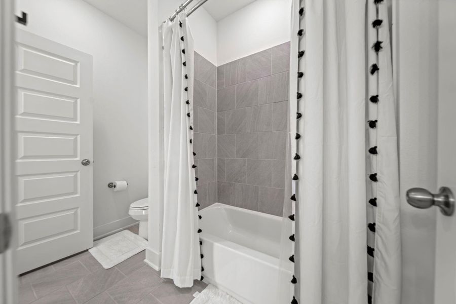 Jack and Jill shower with neutral tiles and plenty of space. Jack and Jill shower with neutral tiles and plenty of space.