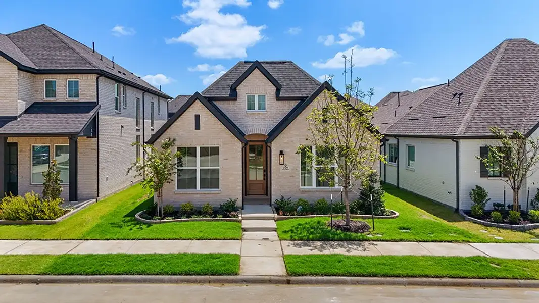 Front exterior of a new home in Cottages of Celina, Celina, TX, highlighting curb appeal (Image 23). Front exterior of a new home in Cottages of Celina, Celina, TX, highlighting curb appeal (Image 23).