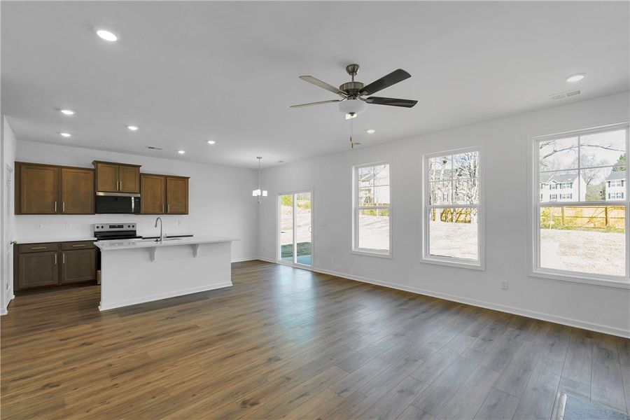 This bright, open-concept living space features wa