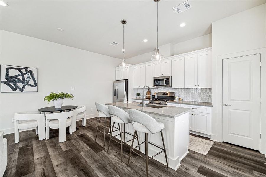 Looking at this view of the kitchen you can see the door to the right is the pantry.