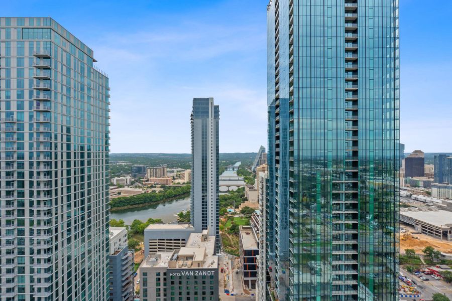 Panoramic city views and serene river vistas from a high-rise vantage point.