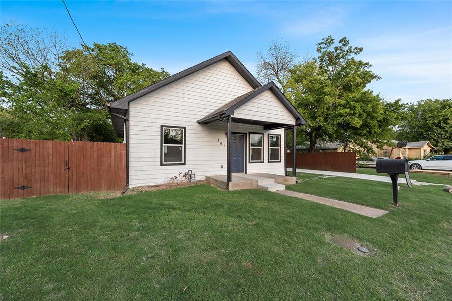 Bungalow-style house featuring a gate