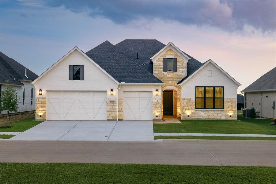 Front exterior of a new home in Robson Ranch Texas, Denton, TX, highlighting curb appeal (Image 18). Front exterior of a new home in Robson Ranch Texas, Denton, TX, highlighting curb appeal (Image 18).