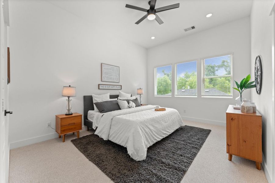 Luxurious and light-filled primary bedroom located on the second floor, showcasing soaring high ceilings that amplify the sense of space and elegance. Expansive windows invite natural light to pour in, highlighting the room’s refined finishes and creating a serene retreat. Luxurious and light-filled primary bedroom located on the second floor, showcasing soaring high ceilings that amplify the sense of space and elegance. Expansive windows invite natural light to pour in, highlighting the room’s refined finishes and creating a serene retreat.