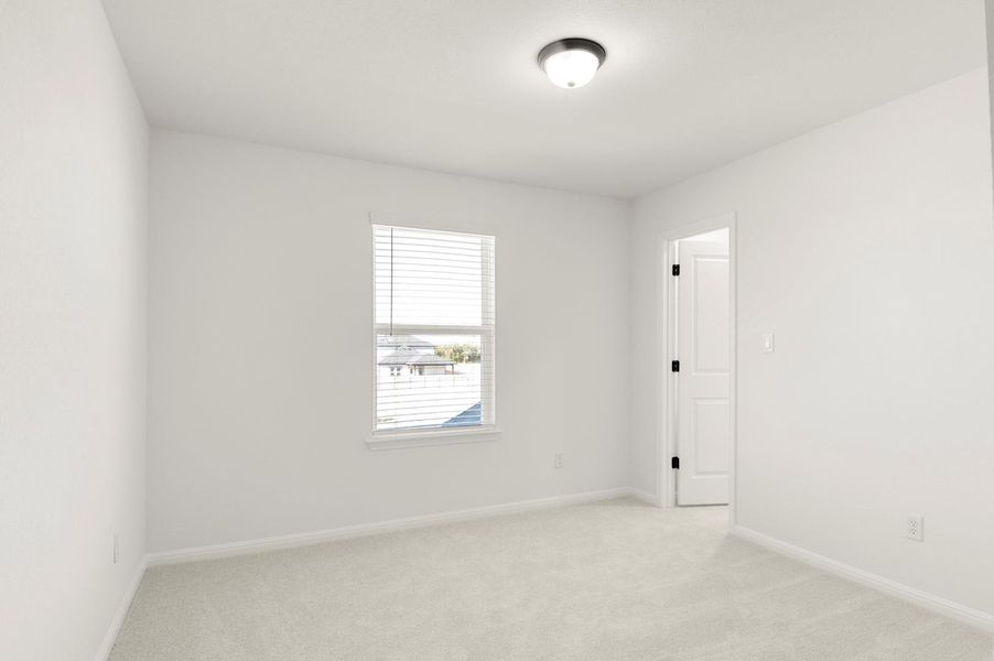 Unfurnished room with light colored carpet
