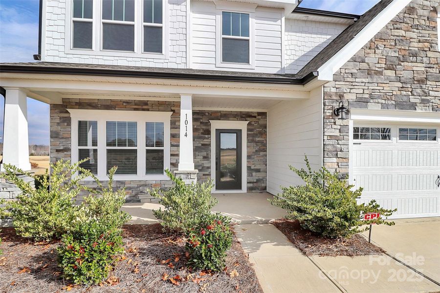 Exterior details and patio area of a home in Stonebridge Fairways, Monroe (Image 23).