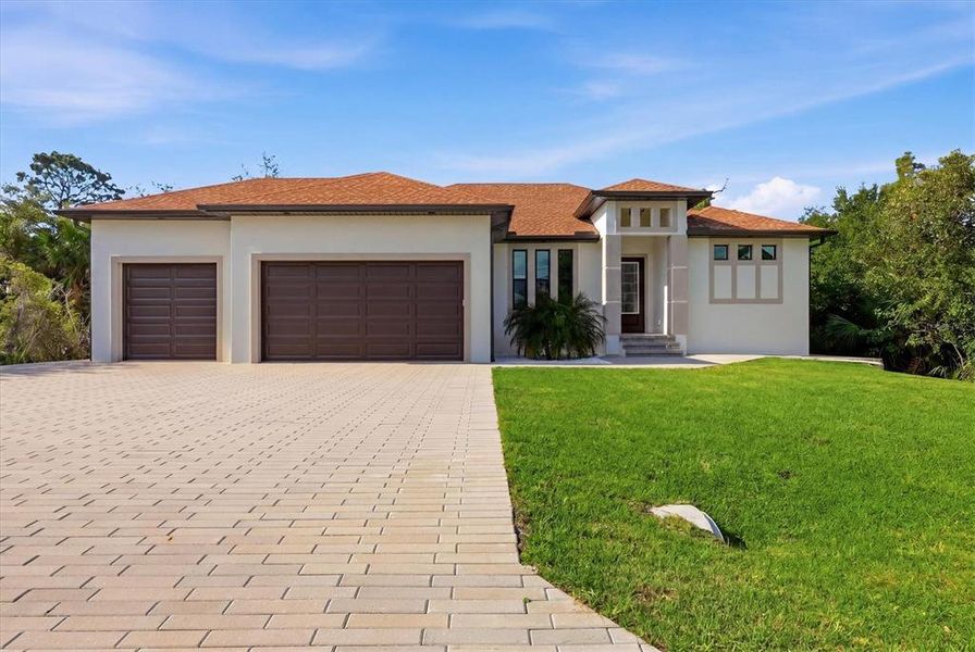 Front exterior of a new home in , Port Charlotte, FL, highlighting curb appeal (Image 24).