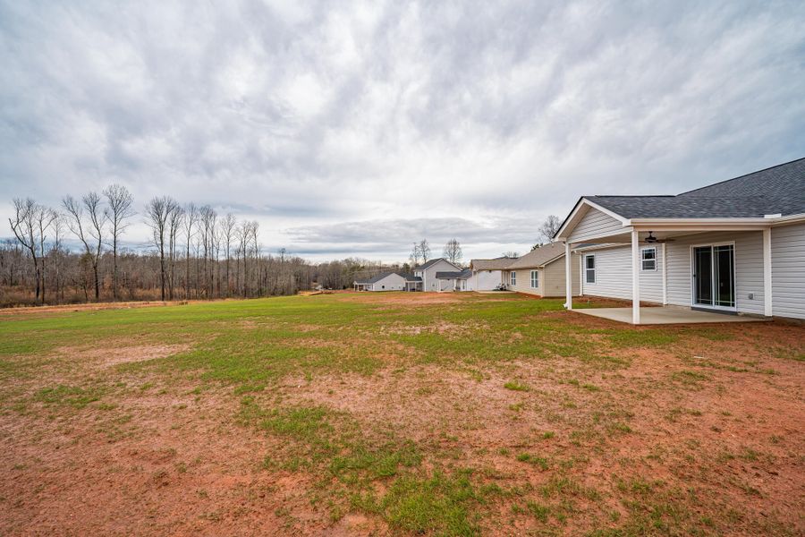 Representative exterior photo of a completed home built from the Saxon by Enchanted Homes in Huckleberry Cove, Chesnee, SC (Image 25). Representative exterior photo of a completed home built from the Saxon by Enchanted Homes in Huckleberry Cove, Chesnee, SC (Image 25).