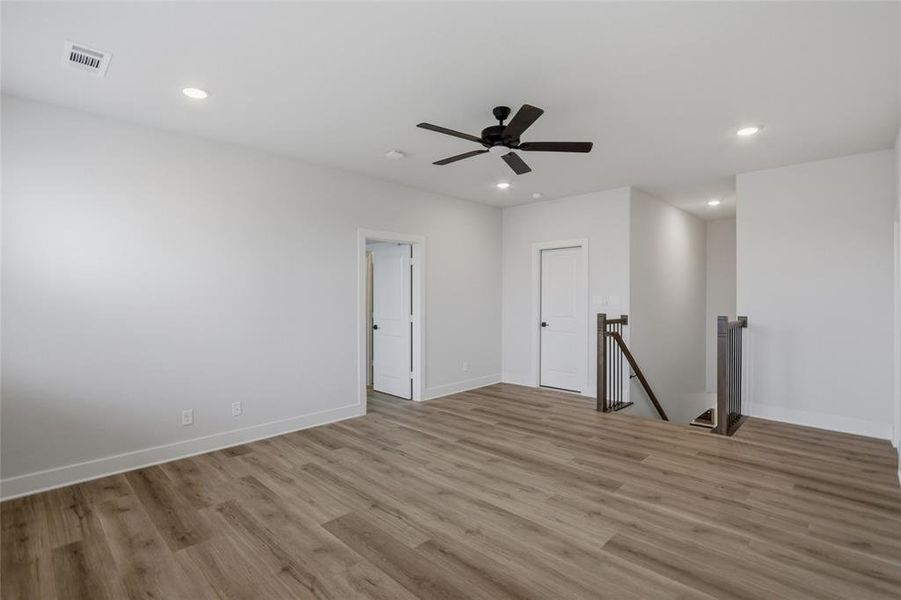 Unfurnished room featuring light wood finished floors, recessed lighting, and a ceiling fan
