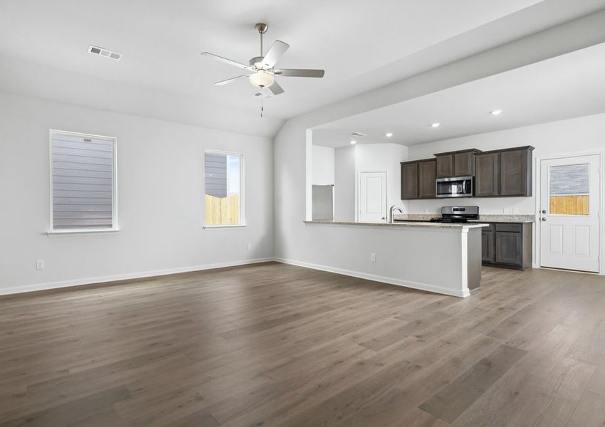 The kitchen, dining room and living room sit adjacent to one another. The kitchen, dining room and living room sit adjacent to one another.