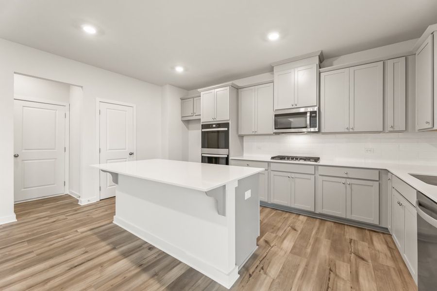 A kitchen with white cabinets. A kitchen with white cabinets.