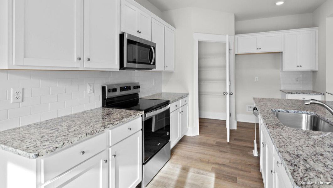 Representative furnished interior of a home built from the Martin by D.R. Horton in Merchant Point, Jacksonville (Image 9).