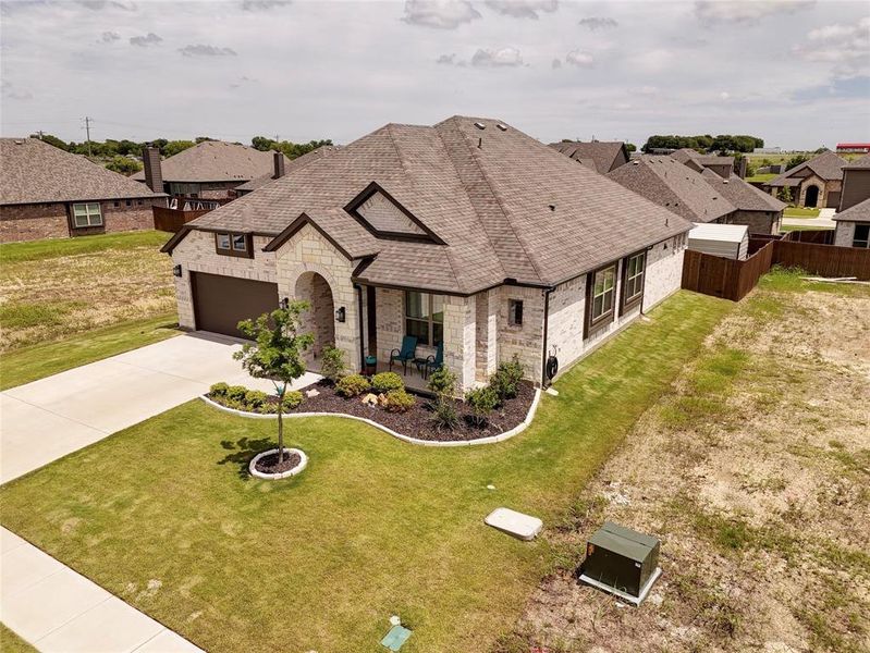Front exterior of a new home in , Venus, TX, highlighting curb appeal (Image 23).