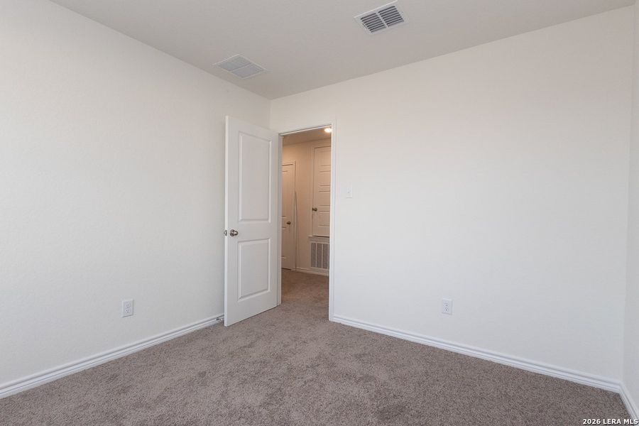 Spacious, unfurnished interior of a new home in Preserve at Culebra - Classic Collection, San Antonio (Image 13).