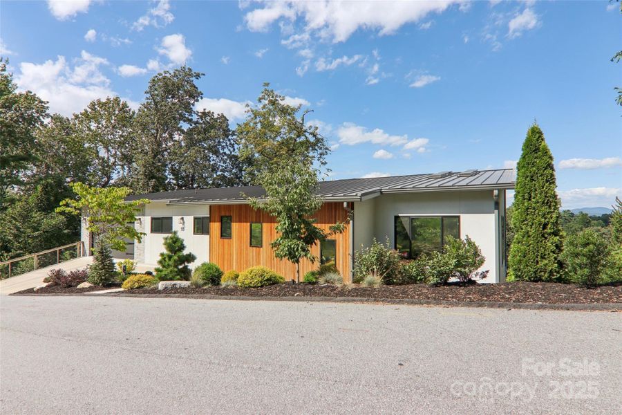 Front exterior of a new home in , Hendersonville, NC, highlighting curb appeal (Image 20).